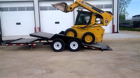 loading skid steer on tilt trailer|highest rated tilt deck trailer.